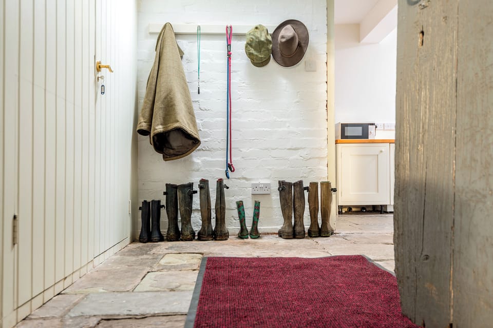 The boot room with plenty of space for wellies, coats and dogs