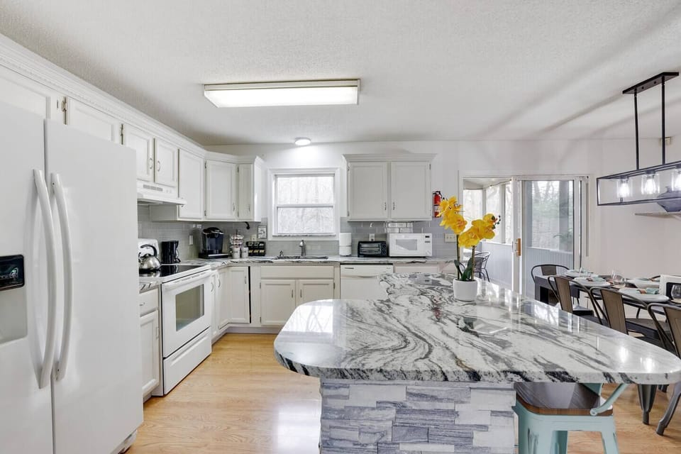 Get together around the newly designed dining / kitchen area