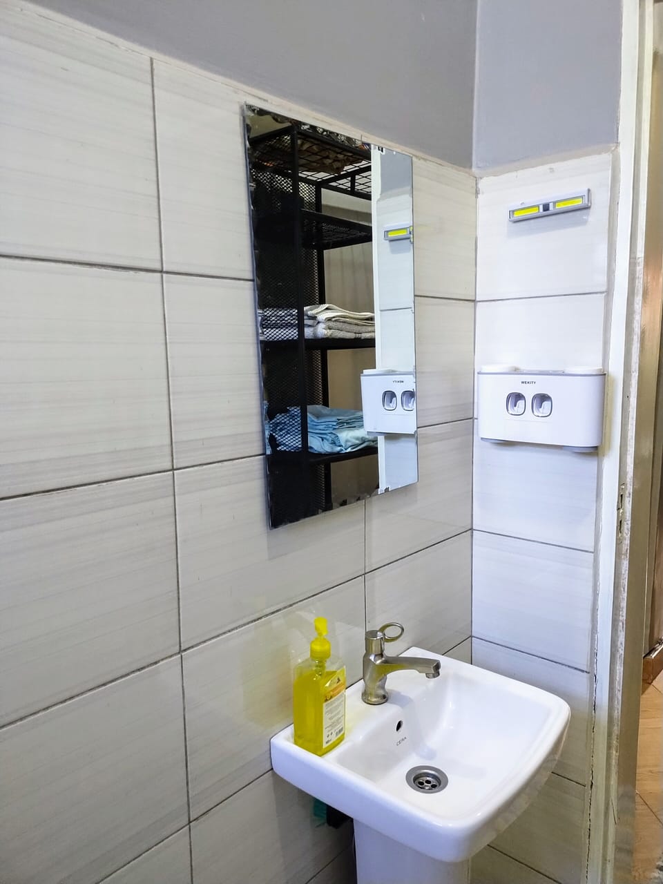 bathroom sink and a toothbrush handler 