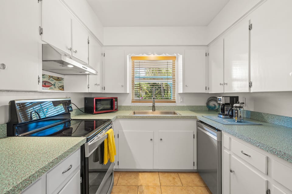 Kitchen with stainless steel appliances or ignore them and eat out! 