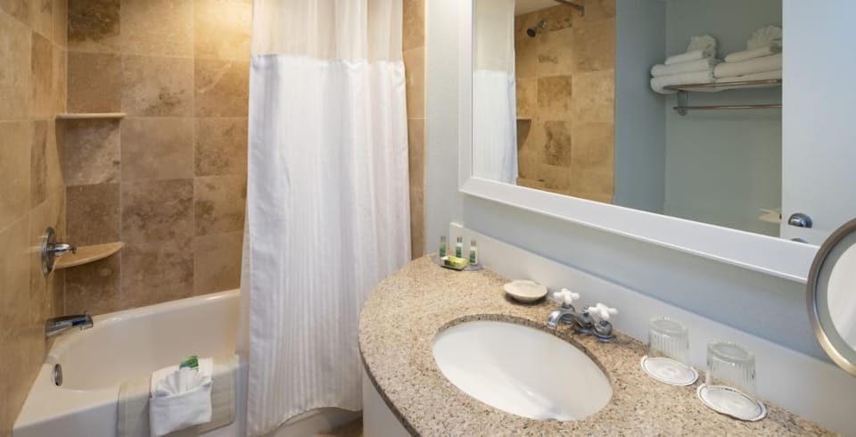Get ready with a wide vanity and bright, clean mirror.