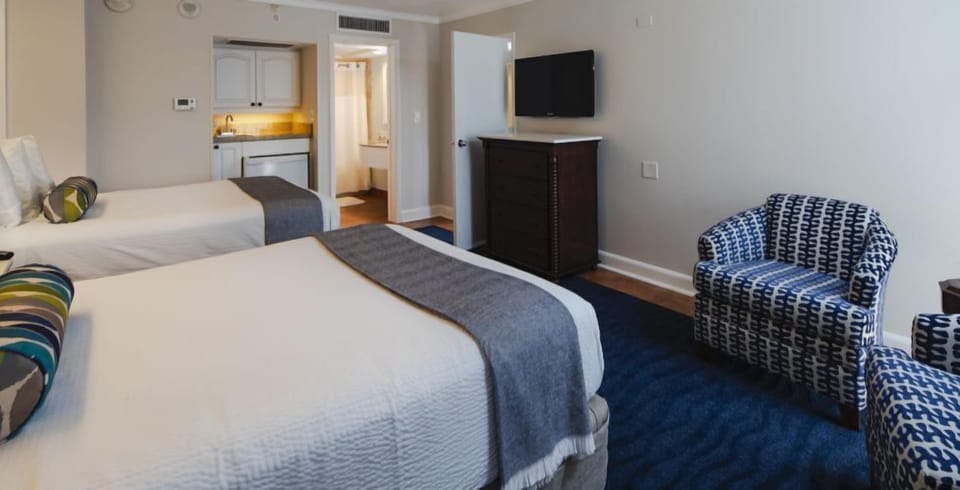 Settle into two plush beds with handy in-room kitchenette.