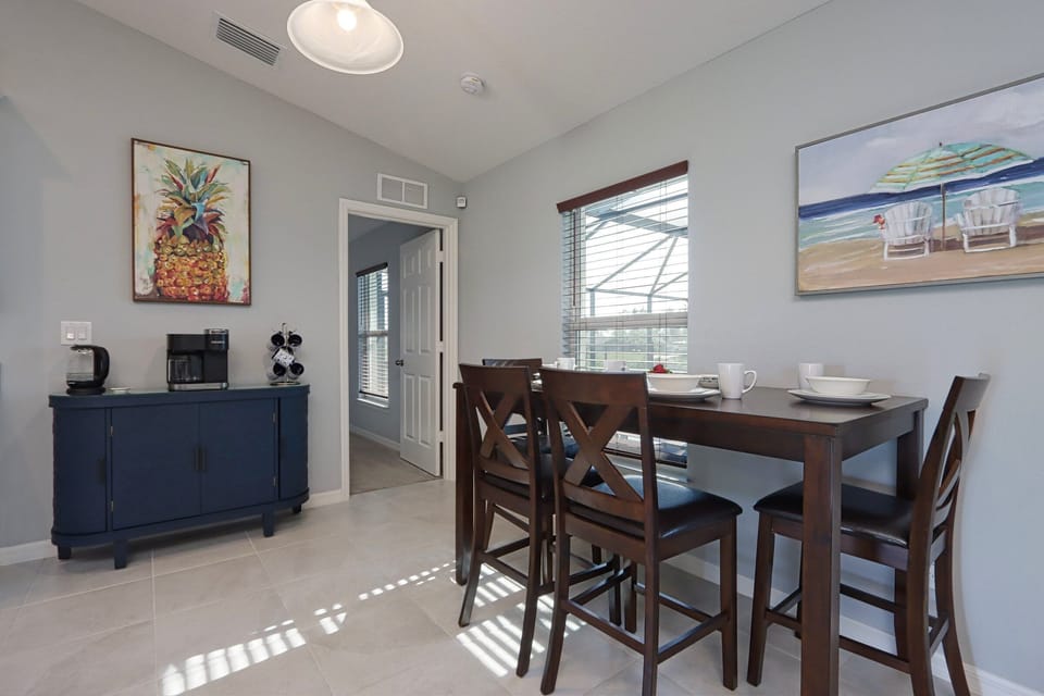 Inviting dining space featuring a cozy table and coffee bar, ideal for relaxed meals or casual gatherings