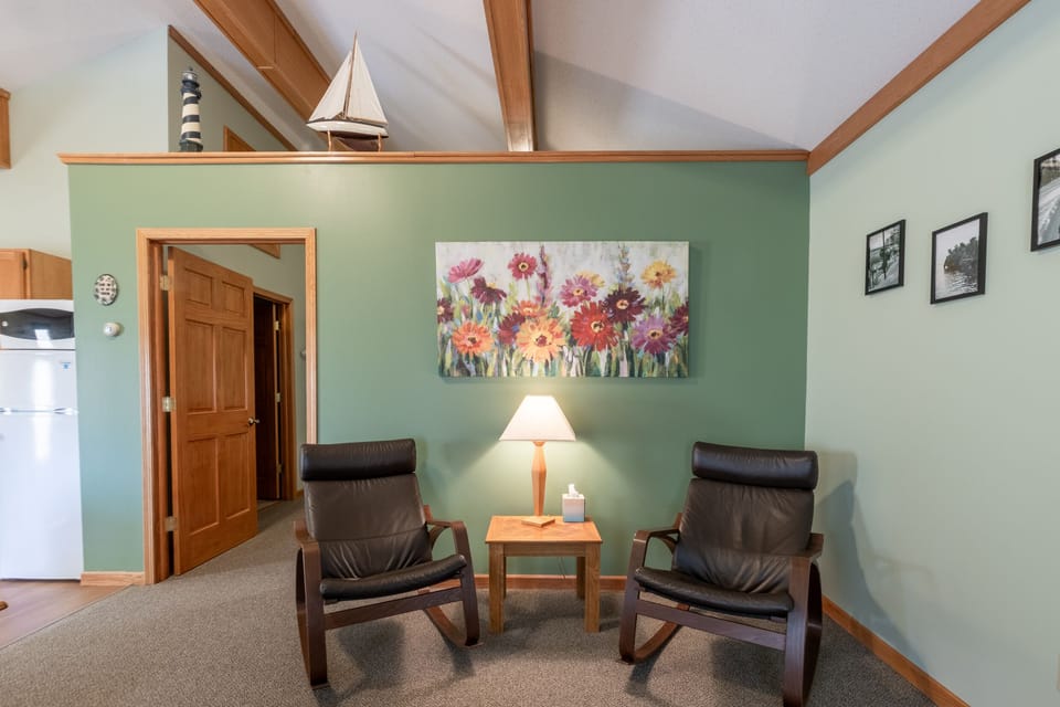 Upper level common area. We love the cathedral ceiling and exposed beams on the upper level!