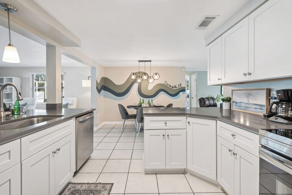 This sunshine stay is equipped with a fully-stocked kitchen- perfect for whipping up vacation goodies! The far right cabinet has been replaced with a dishwasher!