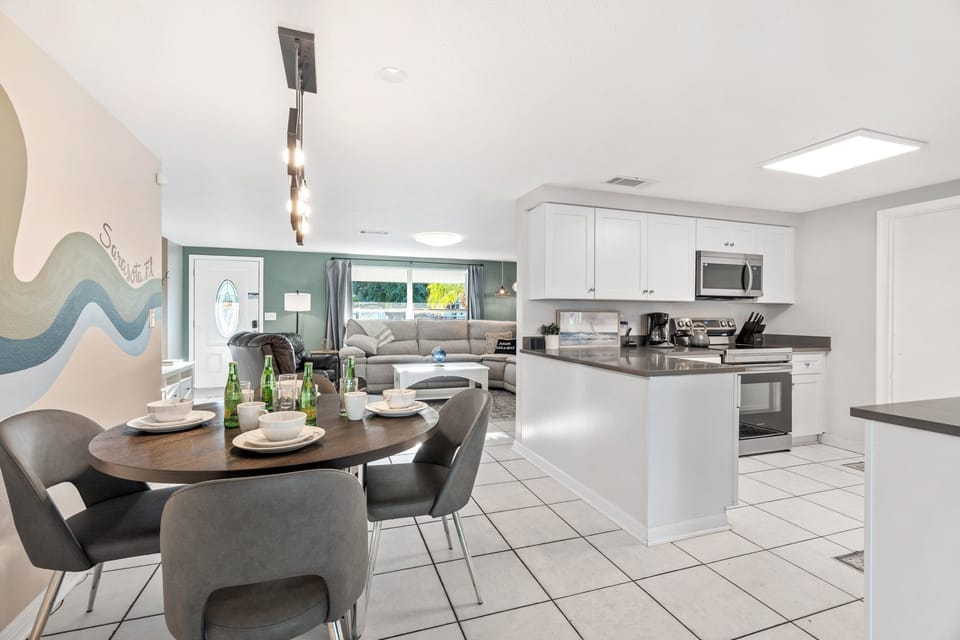 The dining area adjacent to the kitchen is perfect for game nights and dinners with loved ones.