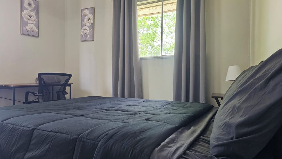 Combine business with comfort in our bedrooms, featuring convenient work areas for your remote work needs