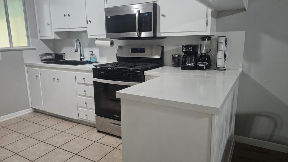 Prepare delicious meals in our kitchen, complete with modern appliances and ample counter space.