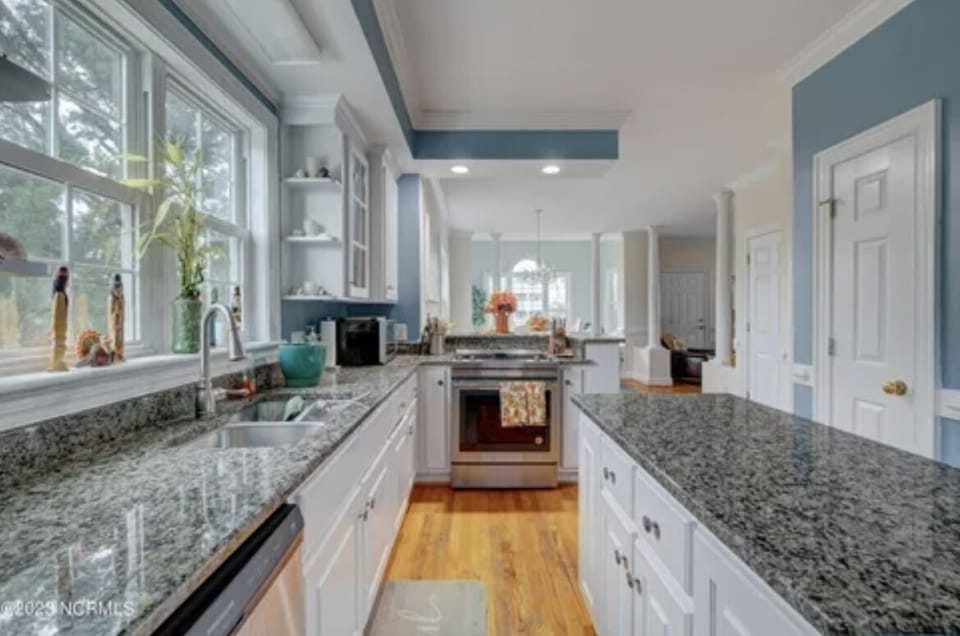 Spacious kitchen w/large island, coffee bar and a ton of kitchen amenities