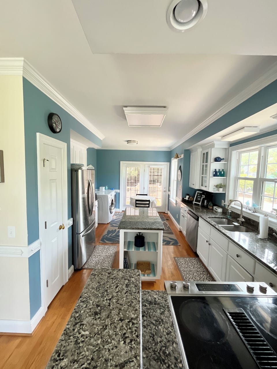 Kitchen view facing doors to back deck