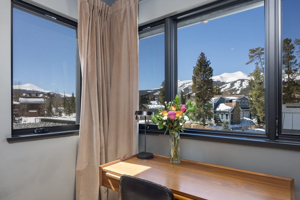 King bed, SmartTV, desk and chair, dressing mirror, huge closet, and en-suite bathroom with soaking tub, walk-in shower, double vanity, and a built-in towel warmer.