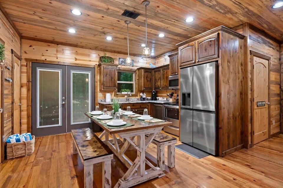Fully equipped kitchen has two seating areas. Dining table easily seats 6