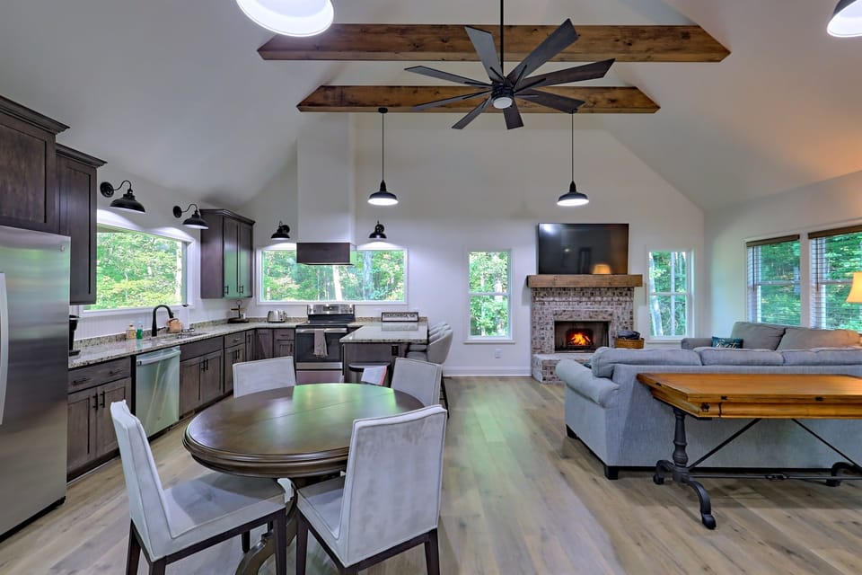 Cozy mountain cabin retreat with a glowing fire pit, inviting porch seating, and warm, welcoming ambiance under a