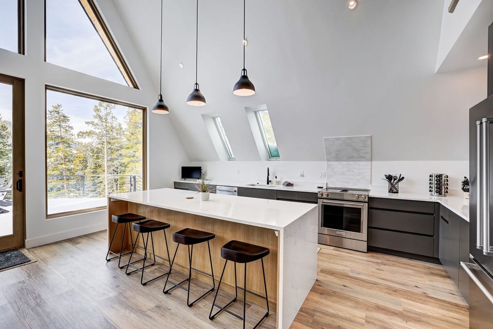 Chefs modern kitchen fully stocked. Waterfall island seats 4