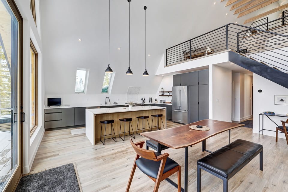 Expansive living and dining area connected to the chef's kitchen