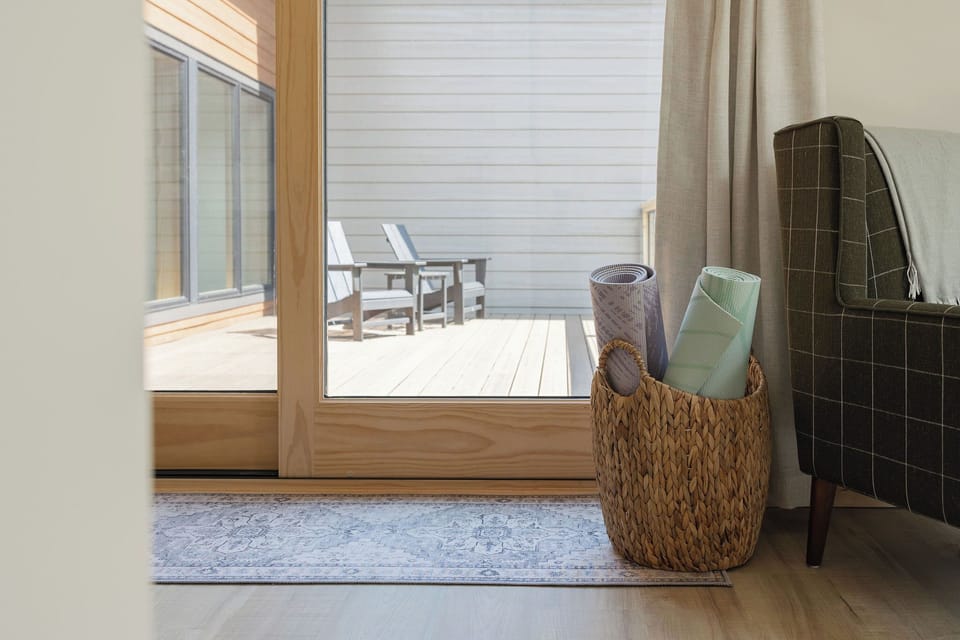 Second floor primary bedroom upper deck access.