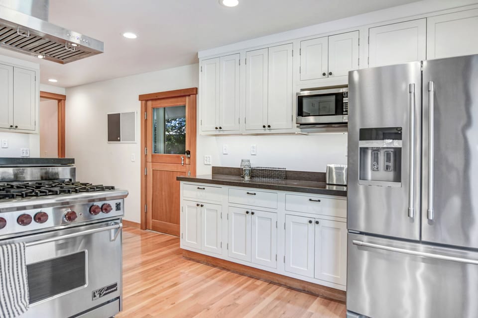 Kitchen includes a large-capacity fridge and bountiful cabinet & counter space!