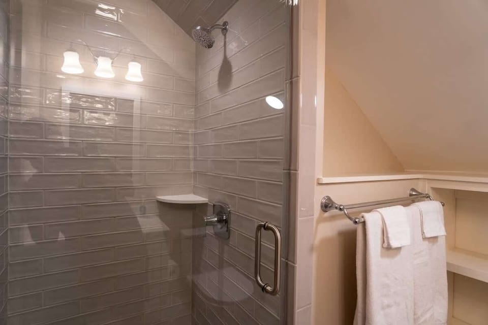 Bathroom with glass shower and bright lighting