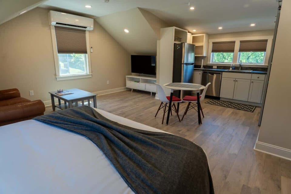 Spacious bedroom with sitting area and TV