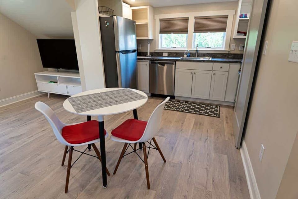 Dining area with table for four and natural light