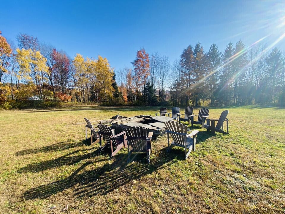 Discover The Lodge, the perfect retreat for up to 14 guests, featuring breathtaking views and endless outdoor fun. Enjoy the wrap-around deck, volleyball court, fire pit, hot tub, and yard games for unforgettable memories!