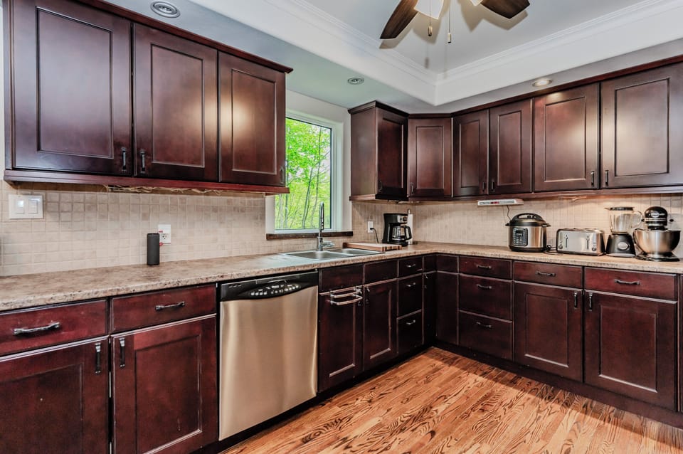 Step into the gourmet kitchen, showcasing top-of-the-line appliances and ample counter space. Whether you're preparing a quick breakfast or a lavish dinner, this kitchen has everything you need to make your culinary creations.