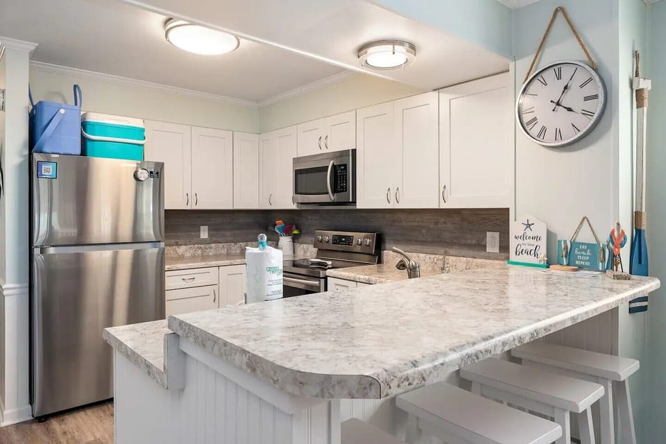 Bright, updated kitchen with ample counter space for meals or takeout.