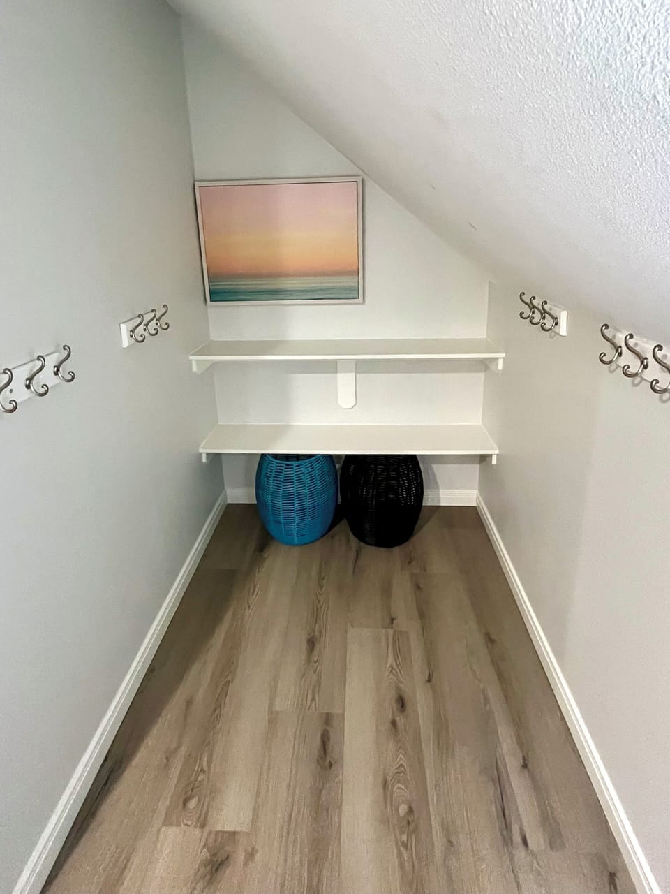 Kids’ loft top level: extra storage space laundry baskets & hooks