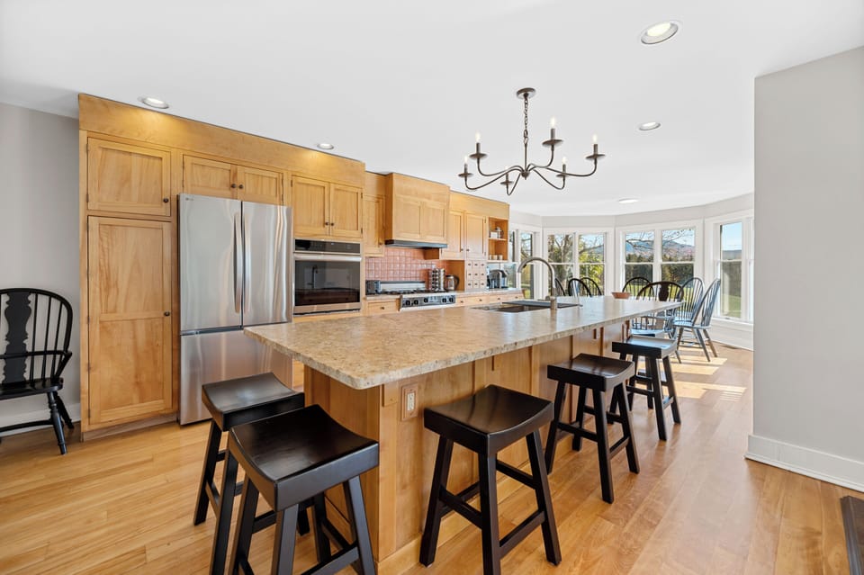 Fully equipped kitchen with large island that seats 6, and table that seats 7-8.