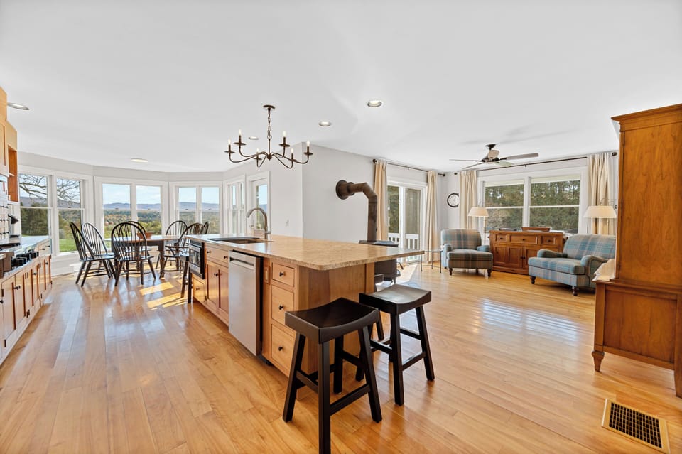 The kitchen has all you need- dishwasher, gas range, oven, microwave, coffee bar