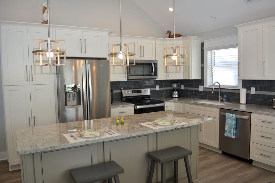 Eat In Kitchen with Stainless Steel Appliances.  Island with 2 Bar Stools