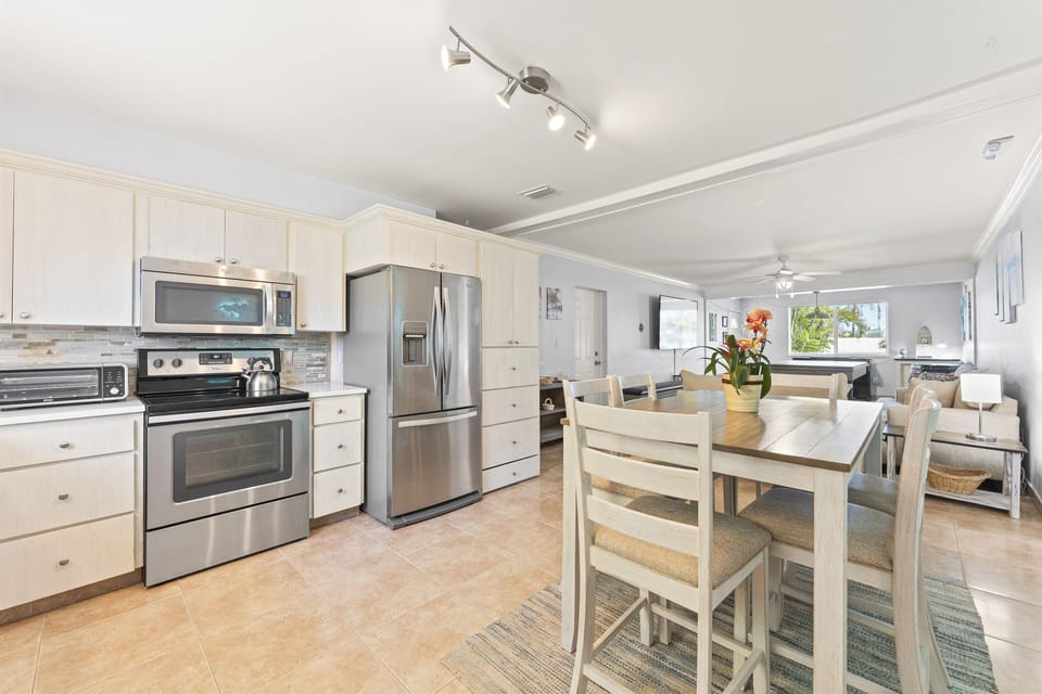 Kitchen dining area with stainless steel appliances