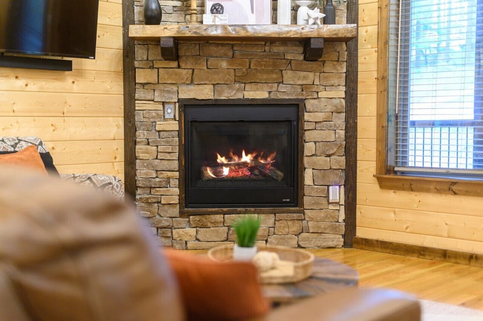 Luxurious stone fireplace with warm ambiance and comfortable seating