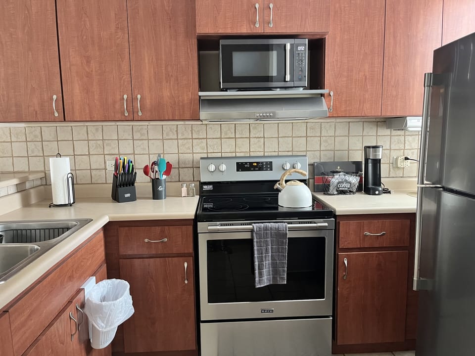 Full kitchen that is open to the living room and dining room.