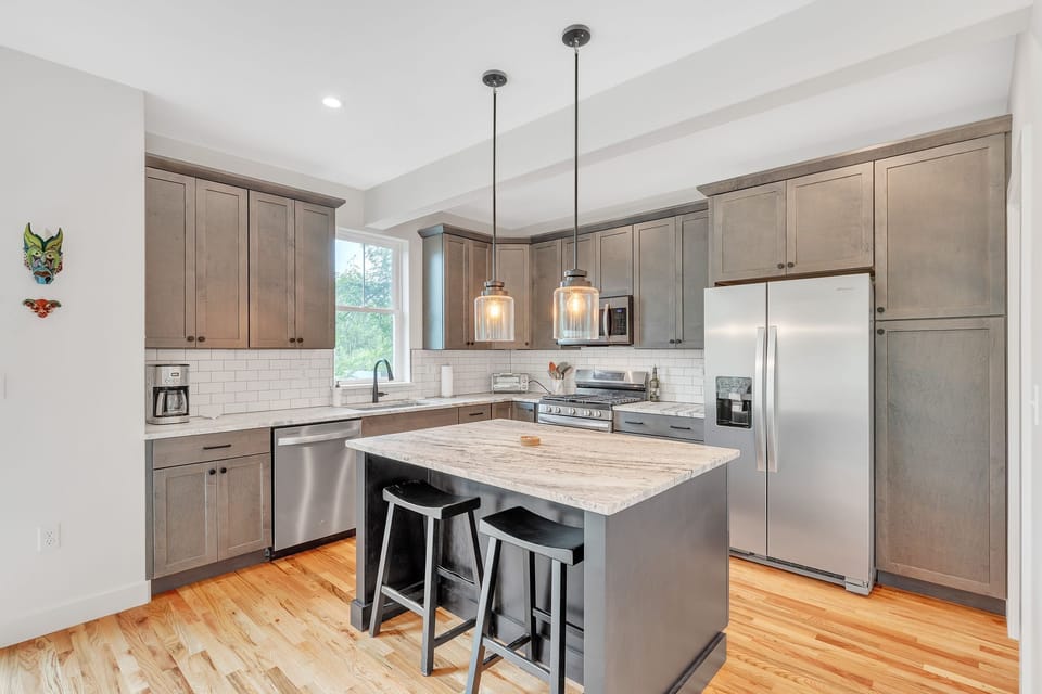 Spacious island and fully equipped kitchen with a regular drip coffee maker and everything you need to prepare meals.