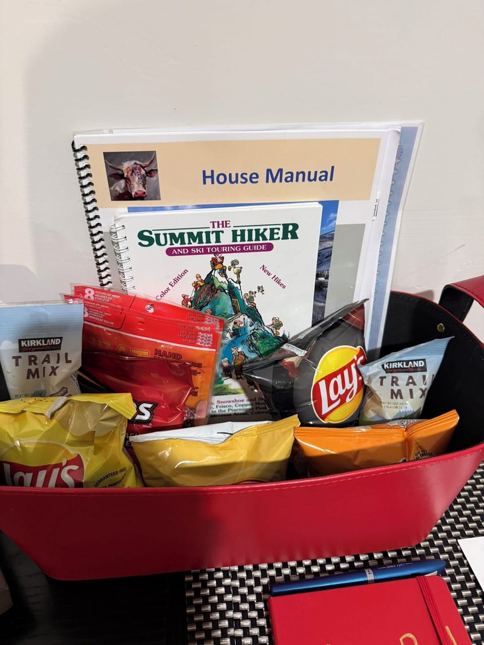 Welcome basket with house manual, guest book and snacks. 