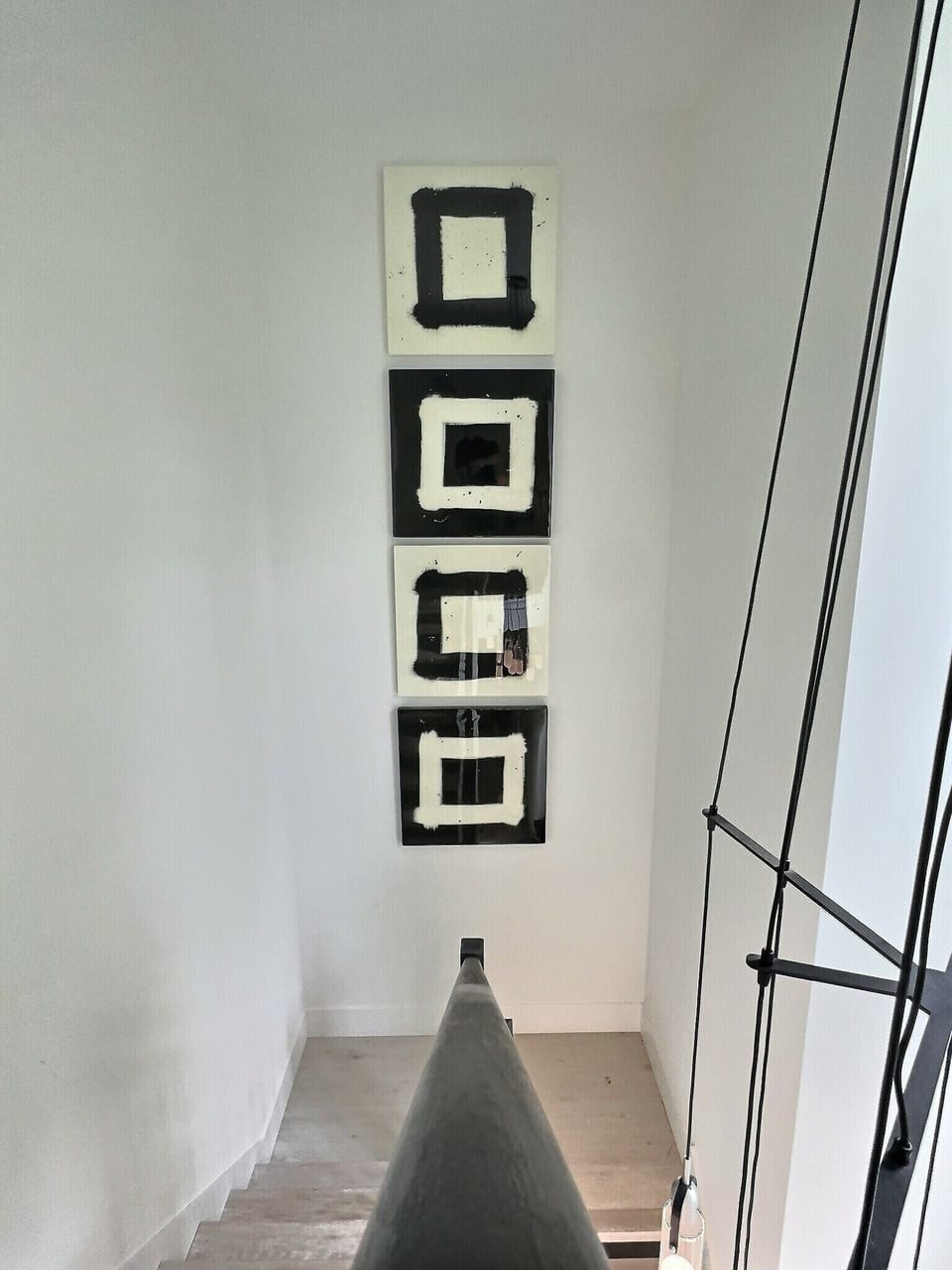 Handmade art from local artists makes the stairwell a captivating focal point.