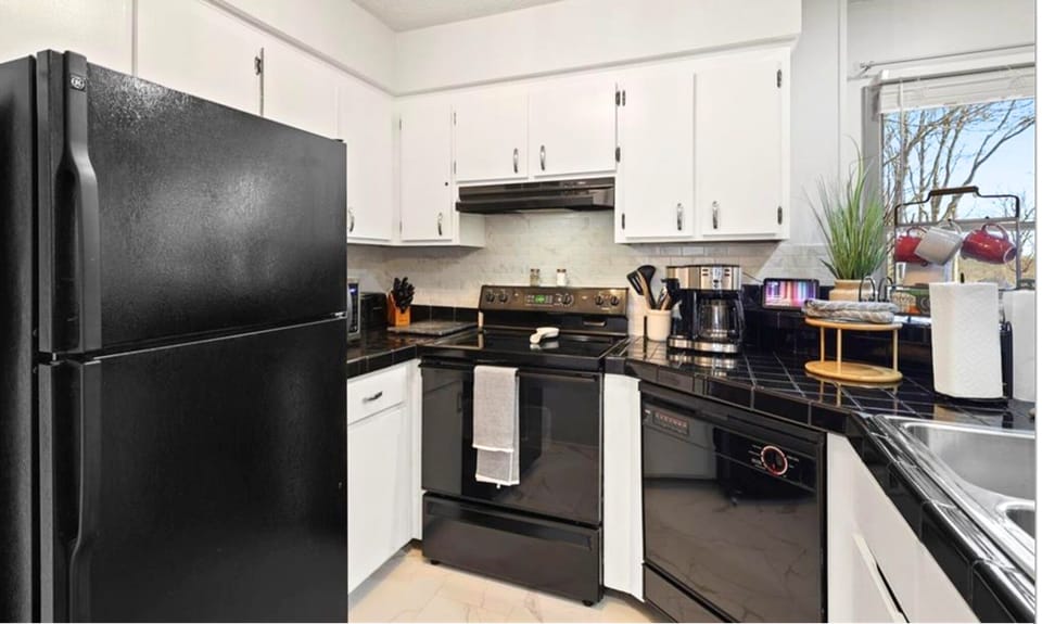 Kitchen with ice making fridge, cooktop stove/oven, microwave, dishwasher, etc