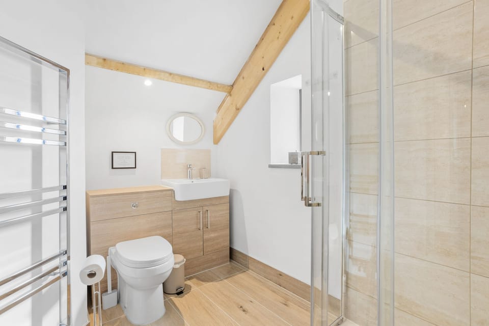 A walk in shower, toilet and hand basin - The Linhay