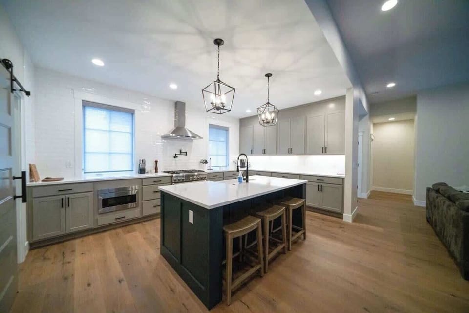 Cook & entertain in style! Our spacious gourmet kitchen boasts stainless steel appliances, ample counters, & a large island with seating.