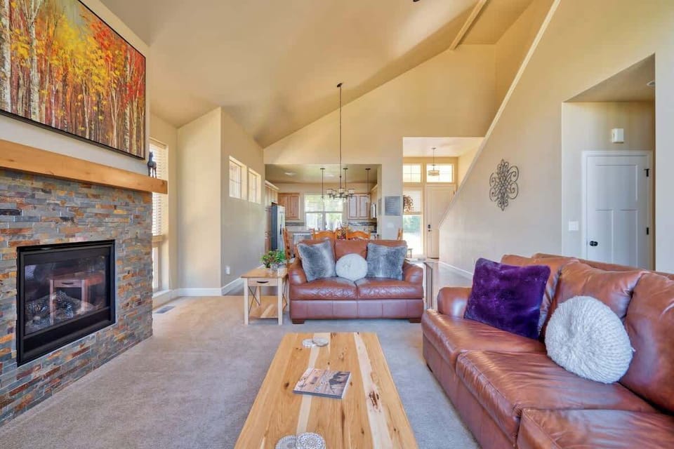 Relax on plush leather couches in the living room, perfect for unwinding and enjoying great conversation.