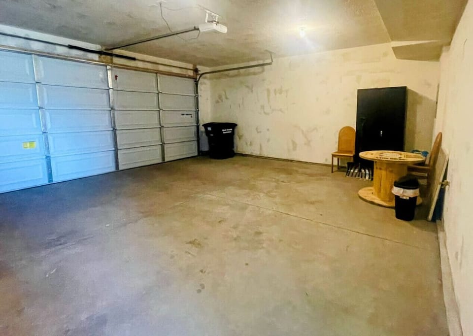 Spacious two-car garage with extra storage and workspace—ideal for projects, parking, or organizing gear.