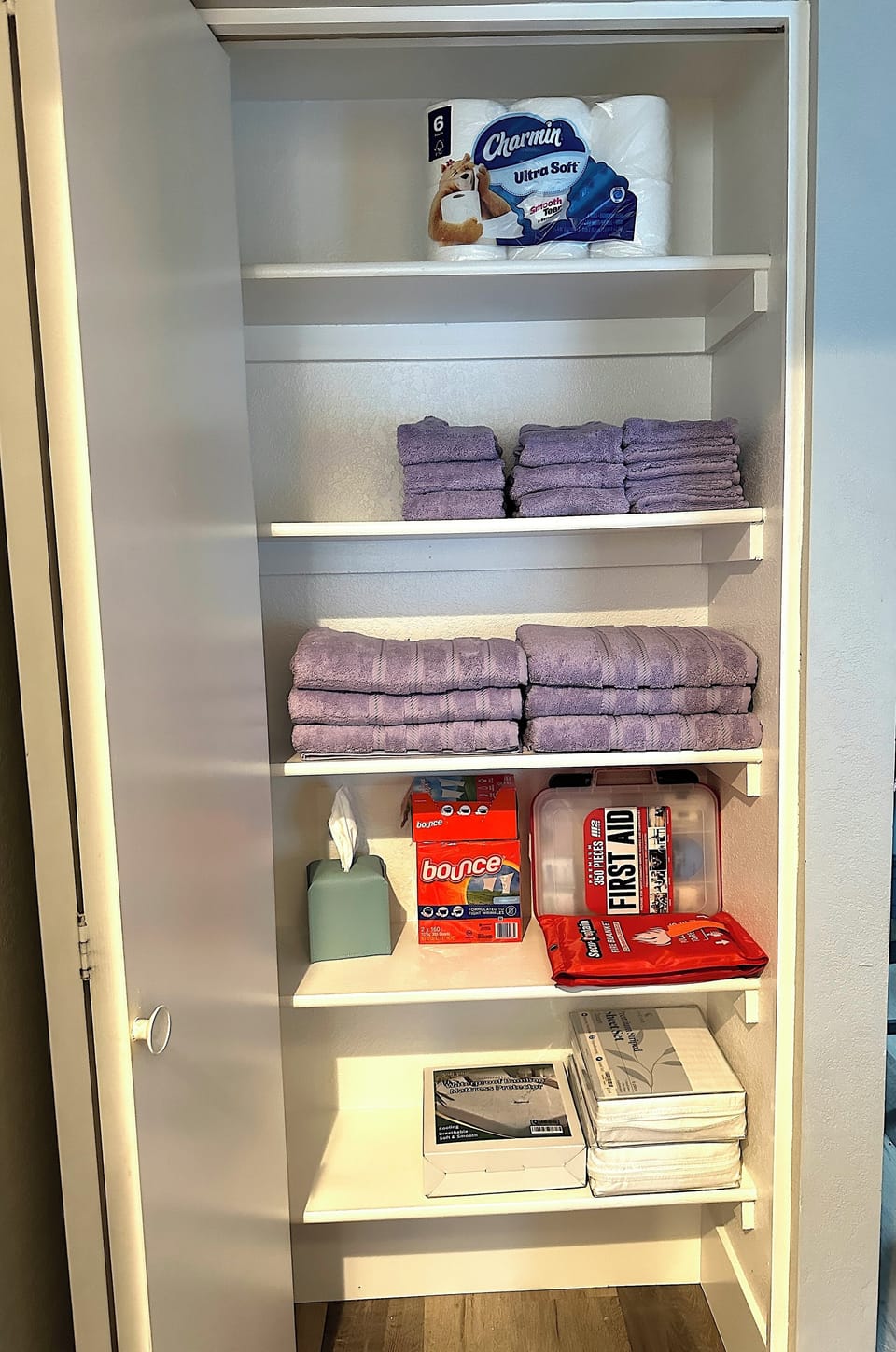 Linen closet with towels for Queen guest