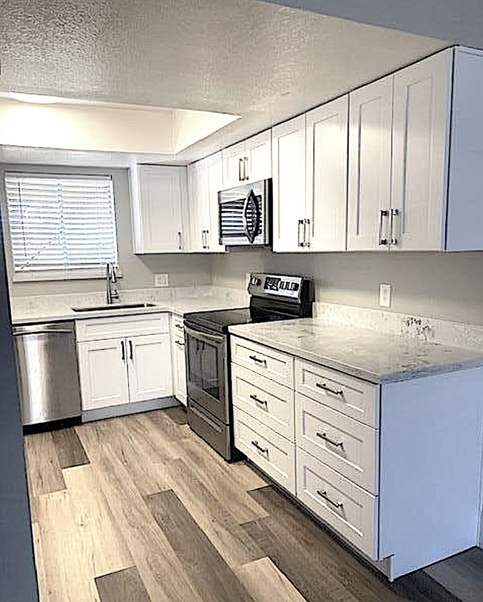 Brand new remodeled kitchen with new counters, cabinets, sink, faucet, etc.
