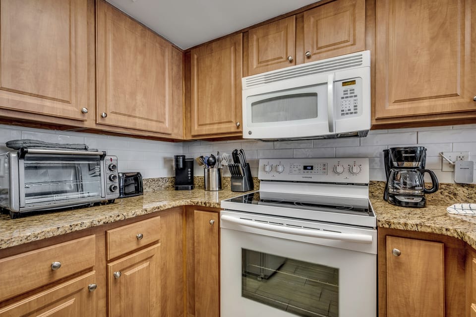A well-equipped kitchen with modern appliances and a clean, functional layout.