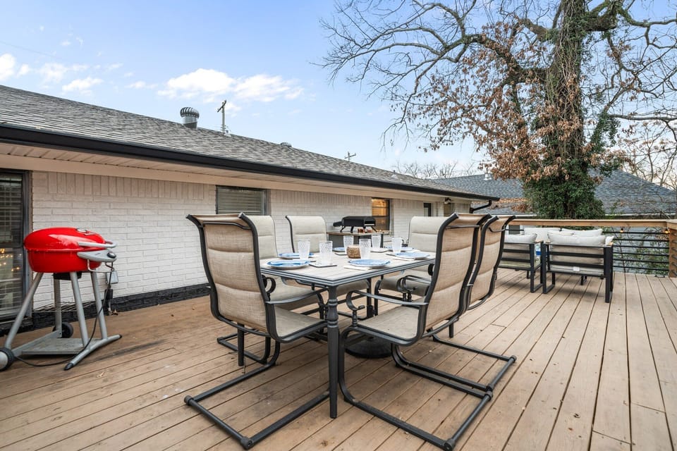 Take the whole party outside — a full deck with dining, lounge seating and the grill ready to go, tucked in under the trees.   Sink into the deck sofa with a drink while the grill heats up — the outdoor room you'll use more than the living room.