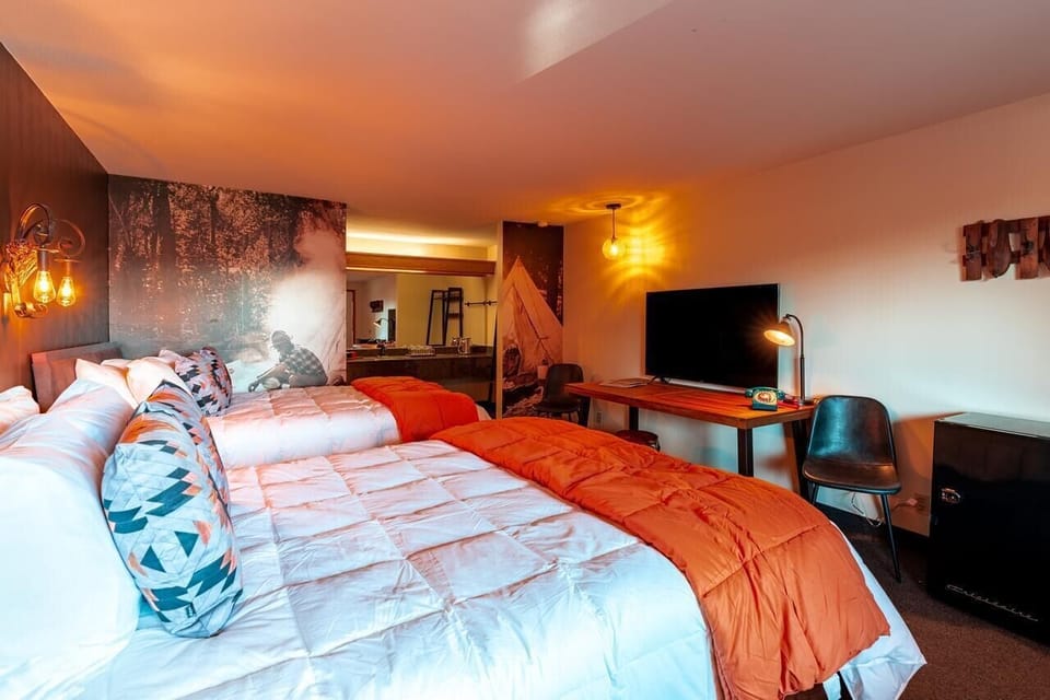 Unwind after adventures with a movie and cozy bedding.