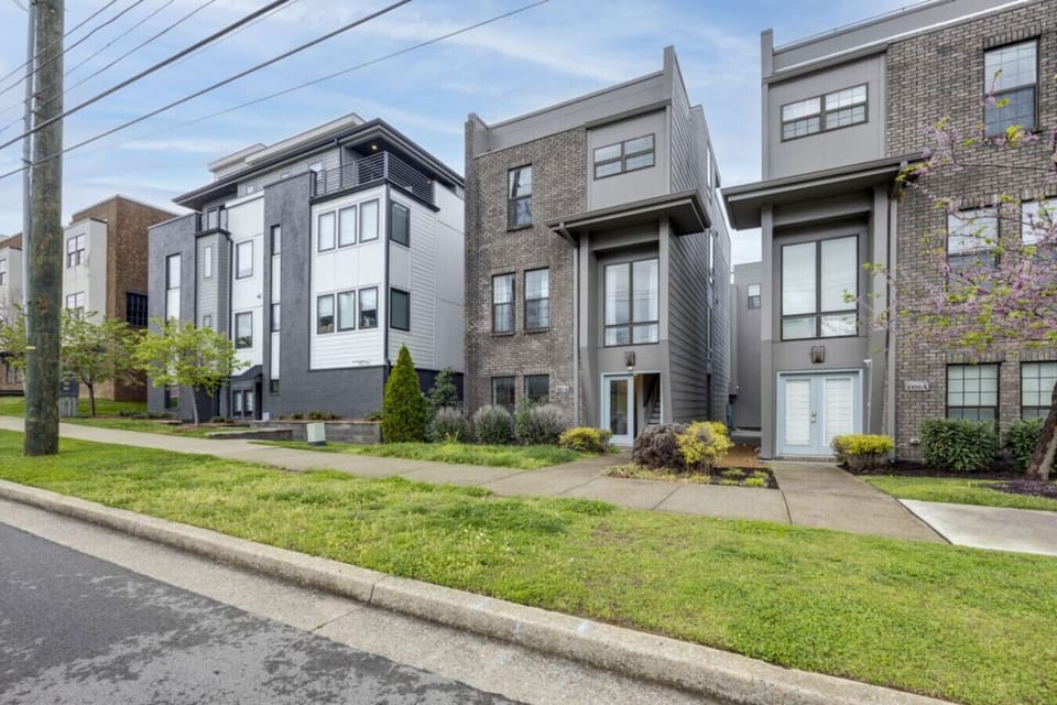 The sleek, modern townhome makes a striking first impression from the street.