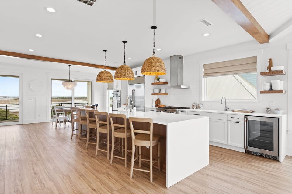 Kitchen equipped with fridge, gas stove, dual dishwashers & sinks and bev fridge