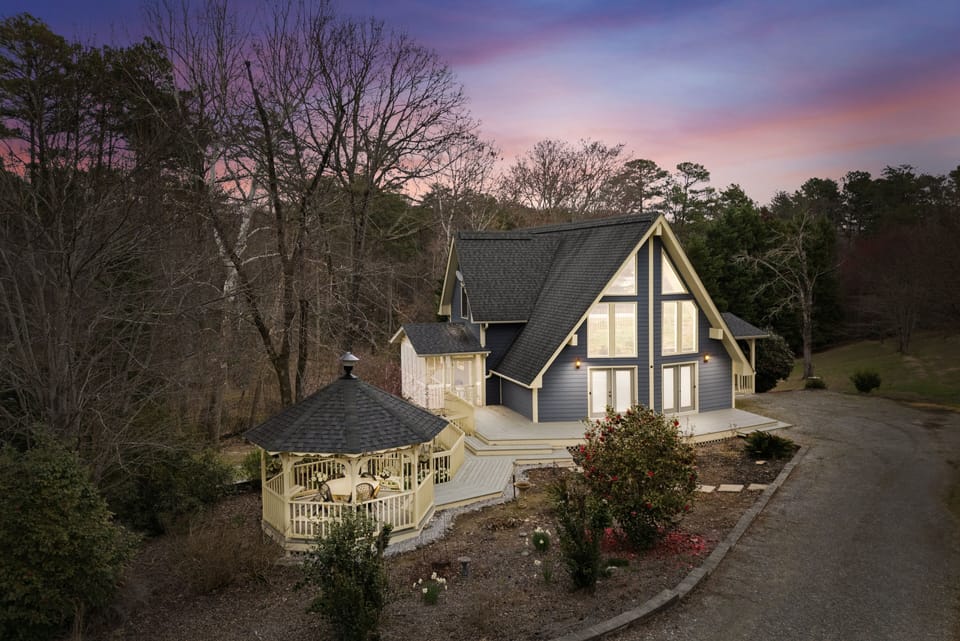 Beautiful A-Frame design with gazebo and screened porch for outdoor enjoyment.